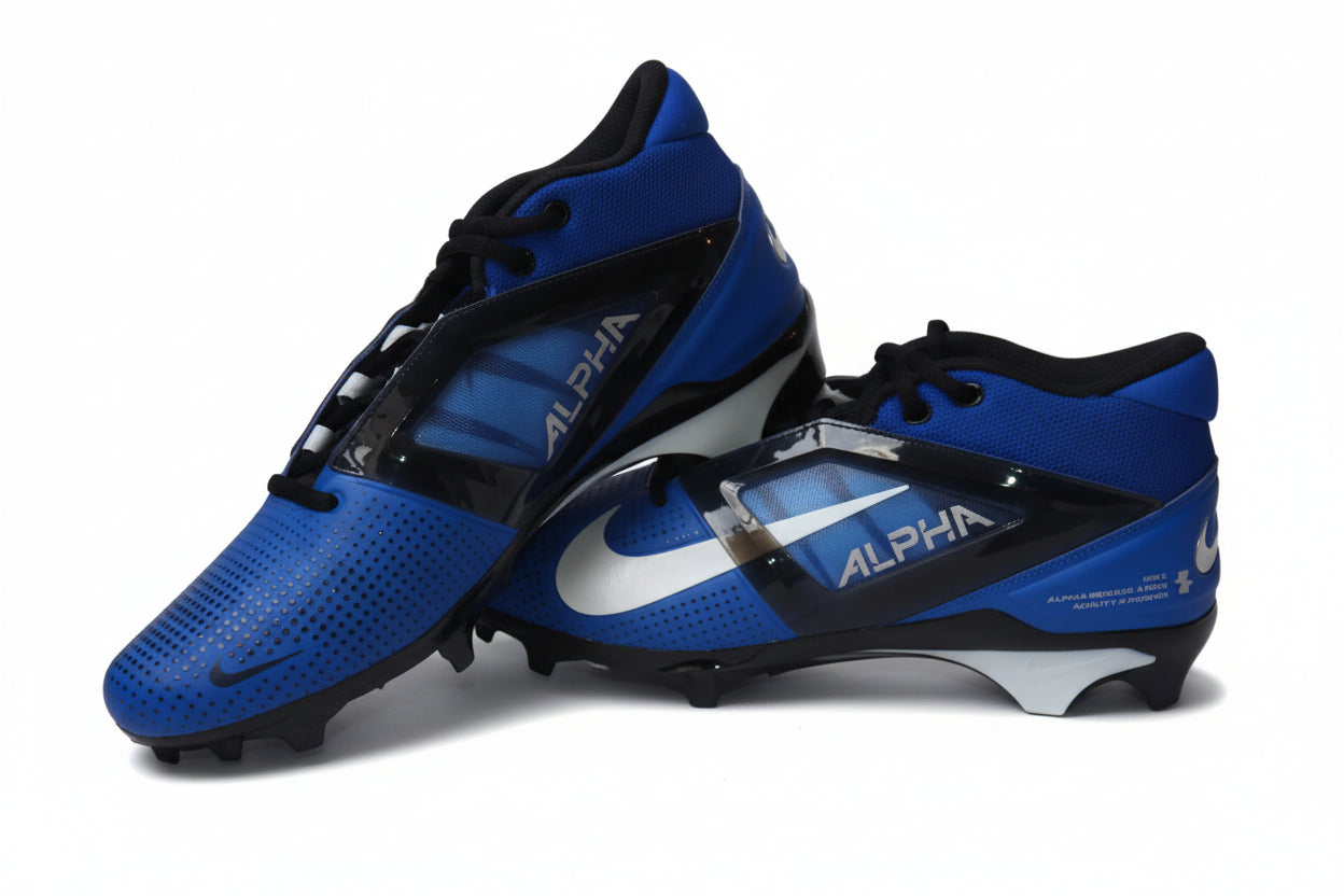 Pair of blue and black Nike Alpha Menace Pro 4 football cleats with white Swoosh and Alpha branding on a light gray background.
