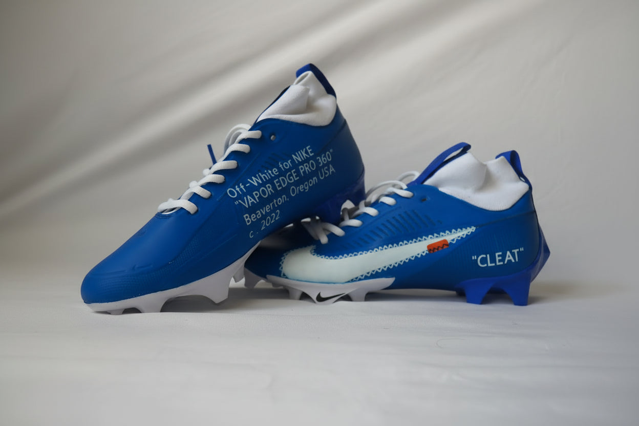 Nike Vapor Edge Pro 360 Custom Off-White football cleats in royal blue with white accents shown on a light background